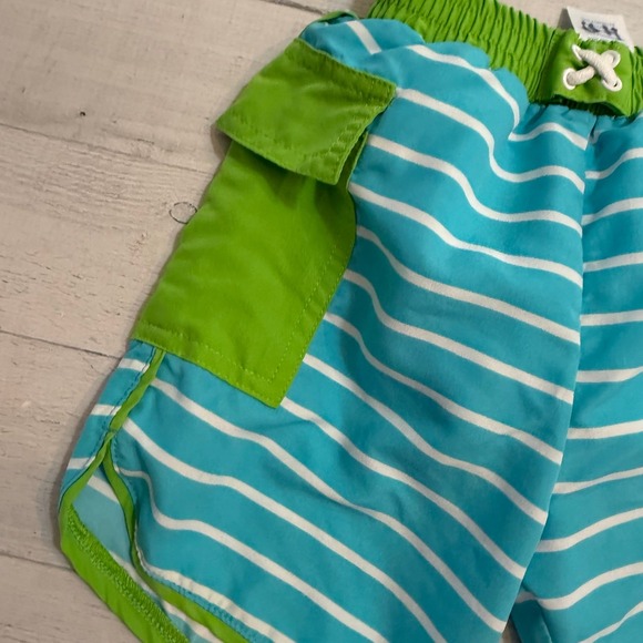i play. Blue and Green Kids Swim Trunks - Picture 2 of 7